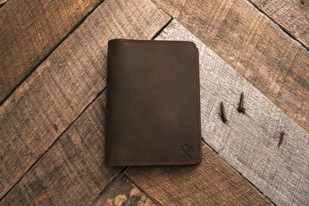 Leather notebook holder on grey wood