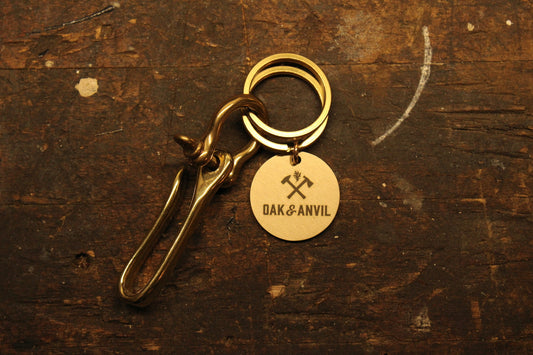 Brass key hook with Oak and Anvil tag on wood